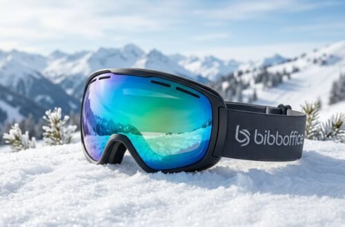 Snow skiing goggles and bib gear on a bright mountain slope with UV protection emphasis
