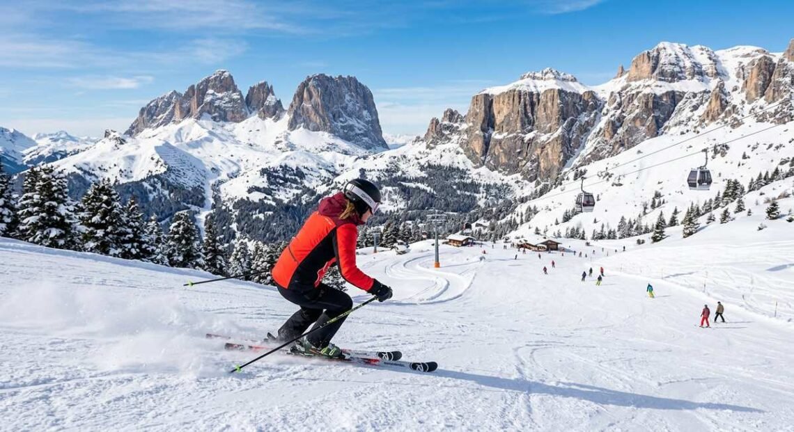 Panoramic view of Dolomites ski slopes with jagged limestone peaks at sunset — the ultimate guide to dolomites skiing