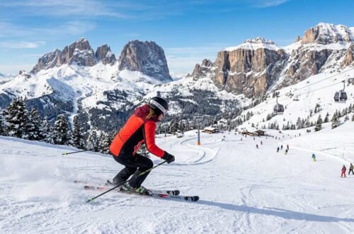 Panoramic view of Dolomites ski slopes with jagged limestone peaks at sunset — the ultimate guide to dolomites skiing