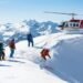 Helicopter banking above deep powder terrain in the Selkirk Mountains near Golden BC — Great Canadian Heli-Skiing territory