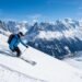 Panoramic winter view of the Mont Blanc massif with ski pistes descending through the Chamonix valley