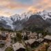 Saas-Fee village panorama surrounded by Swiss Alps glaciers and peaks