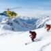 white wilderness heli skiing operation near Terrace BC with Coast Mountain backdrop and helicopter on snow