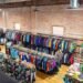 Outdoor gear store with racks of discounted ski jackets and boots, the best time to buy ski gear scene