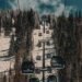 Steamboat gondola cabins climbing a snowy ridge, an Ikon Pass unlimited resort in the epic vs ikon pass decision