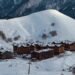 Ski resort village lodges at the base of a snowy mountain, the lodging line in how much does a ski trip cost