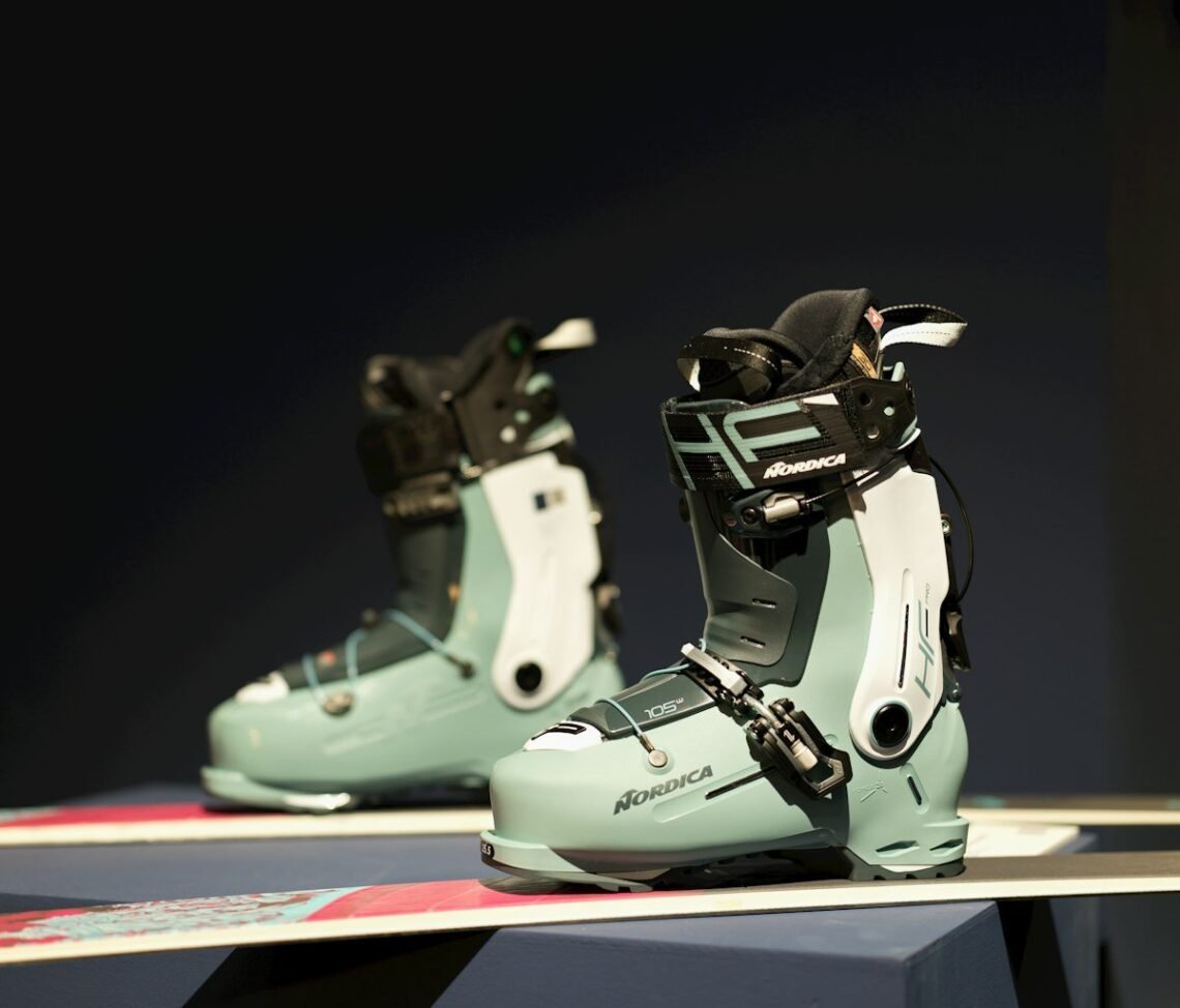 Pair of modern ski boots on a display bench, the starting point for diagnosing ski boot pain