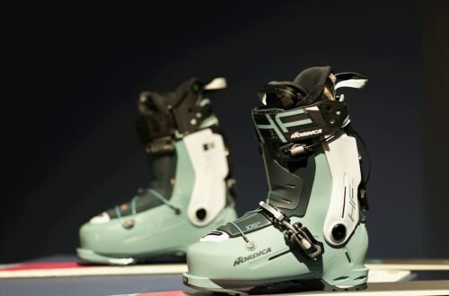 Pair of modern ski boots on a display bench, the starting point for diagnosing ski boot pain